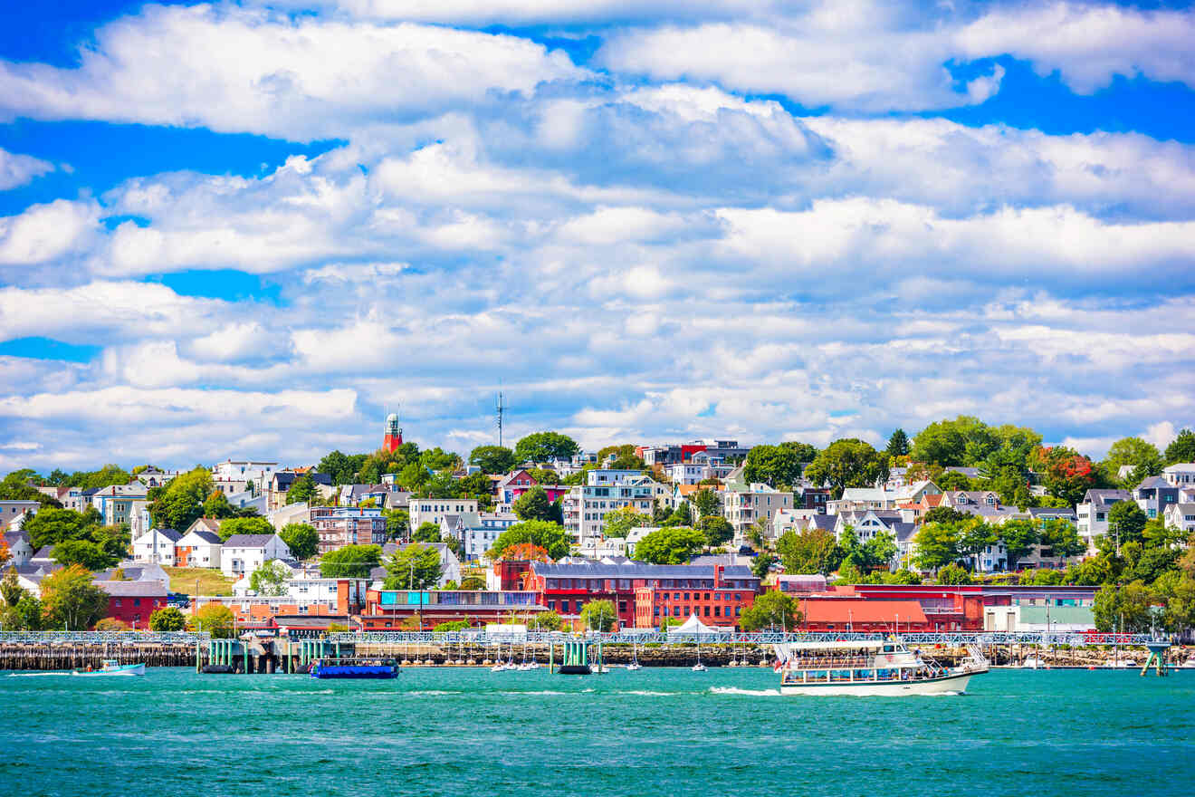 Portland with colorful buildings along the waterfront, a red brick waterfront building, and a boat-filled harbor.
